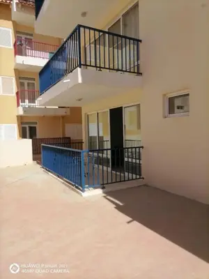 a balcony of a building with a blue railing at Solaren Apartments Boavista in Sal Rei
