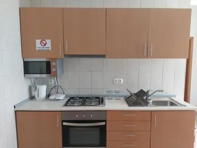 a kitchen with a stove and a sink at Solaren Apartments Boavista in Sal Rei