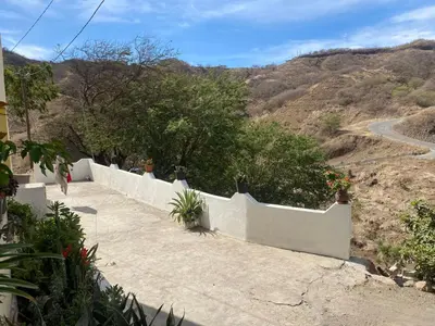 a path with a white fence and a mountain at Kasa di Terra in Sacramento