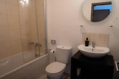 a bathroom with a toilet and a sink and a shower at Casa Cubada in Santa Maria