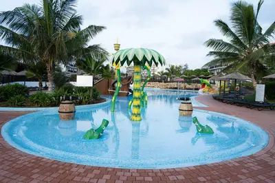 a pool at a resort with a water slide at Casa Cubada in Santa Maria