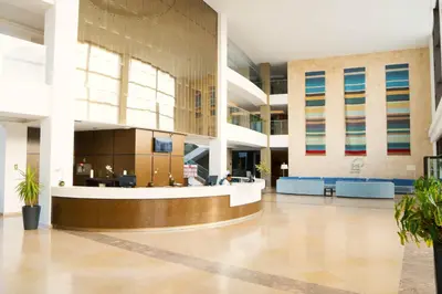 an empty lobby of a building with a waiting area at Casa Cubada in Santa Maria