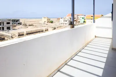 a balcony with a view of a city at Casa Branca Beach in Santa Maria