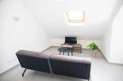 a living room with a couch and a table at Casa Branca Beach in Santa Maria