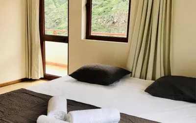 a bedroom with a bed with a stuffed animal on it at Residencial Lela d'Fermina in Pombas