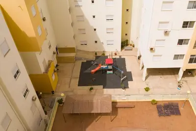 an overhead view of a courtyard between two buildings at 3 bedroom apt, Exterior POOL , Cidadela - LCGR in Praia