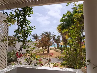 a view of the beach from the window of a house at Praia de Chaves Bungalow ,Boavista in Sal Rei