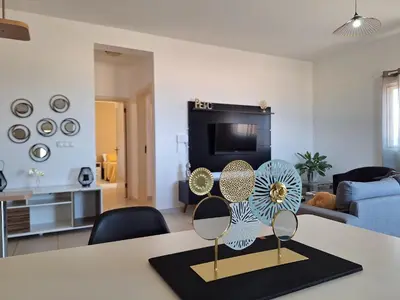 a living room with a table with two fan on it at Ca Luna Deluxe sun & Beach in Sal Rei