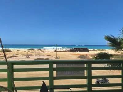 a view of the beach from a fence at Ca Luna Deluxe sun & Beach in Sal Rei