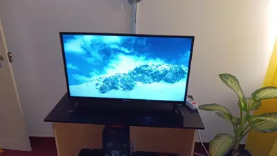 a flat screen tv sitting on top of a table at Casa de Férias in Tarrafal