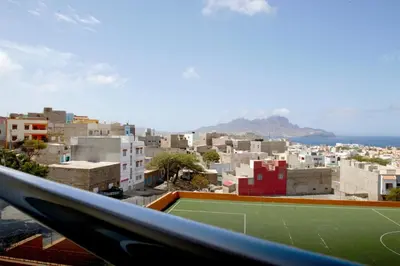 a tennis court on top of a city at Duarte Apartments - Vista in Mindelo