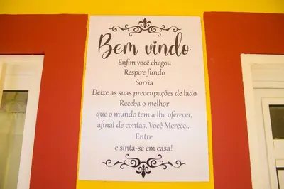 a sign on a wall with a menu on it at Cosy & Relax Yellow House 5mn walk from the beach! in Calheta Do Maio