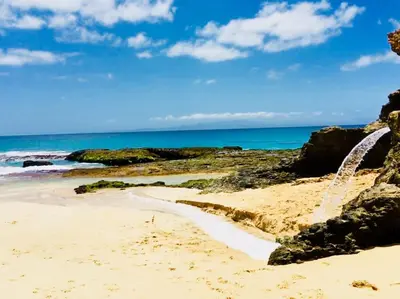 a sandy beach with the ocean in the background at Cosy & Relax Yellow House 5mn walk from the beach! in Calheta Do Maio