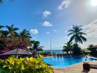 a swimming pool with a view of the ocean at Porto Antigo 2 - By Bobbywashere in Santa Maria