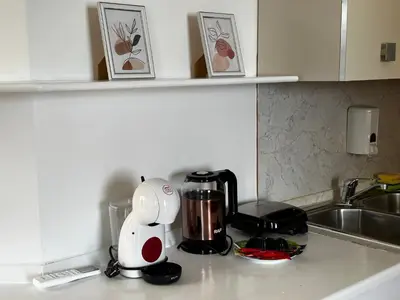 a kitchen counter with a toaster and a blender on it at Porto Antigo 2 - By Bobbywashere in Santa Maria