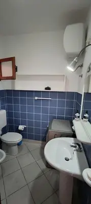 a bathroom with a sink and a toilet at Blu Shell - Ca' Greta in Sal Rei