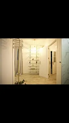 a room with a hallway with a light and a door at As Hortênsias in Mindelo