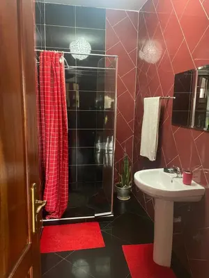 a bathroom with a shower and a sink at Tarrafal House in Tarrafal