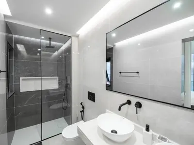 a white bathroom with a sink and a shower at Apartment Sunset in Mindelo